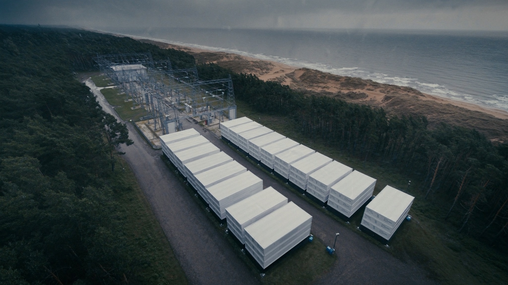 Illustrative view: battery storage yard beside a substation near the Baltic Sea coast in western Latvia